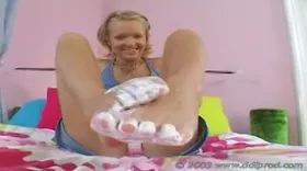 She rubs cream on her feet—if there are any foot fetishists who like that...