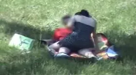 They fuck outdoors and get filmed by a big voyeur